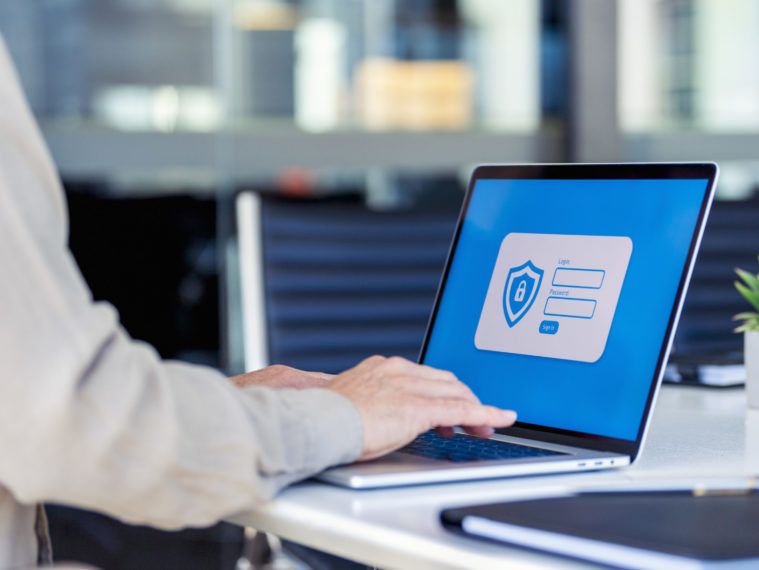 Businessman logging on to a password protected website