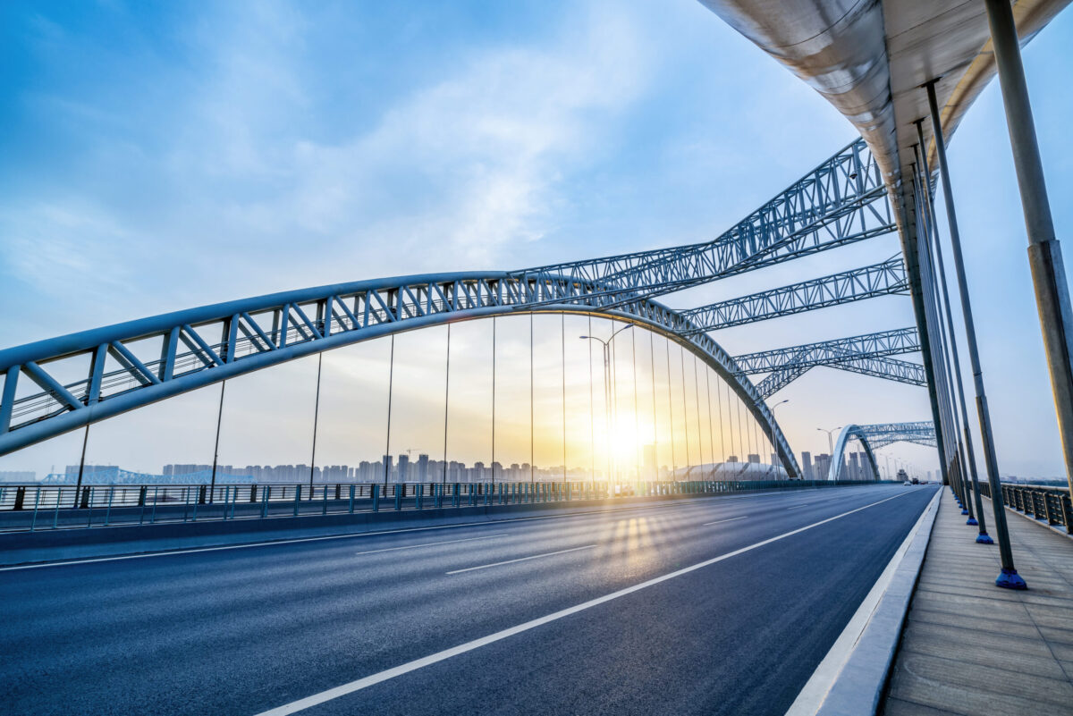 Partnerschaft mit IBS Modern bridge night, day and orange light blue.